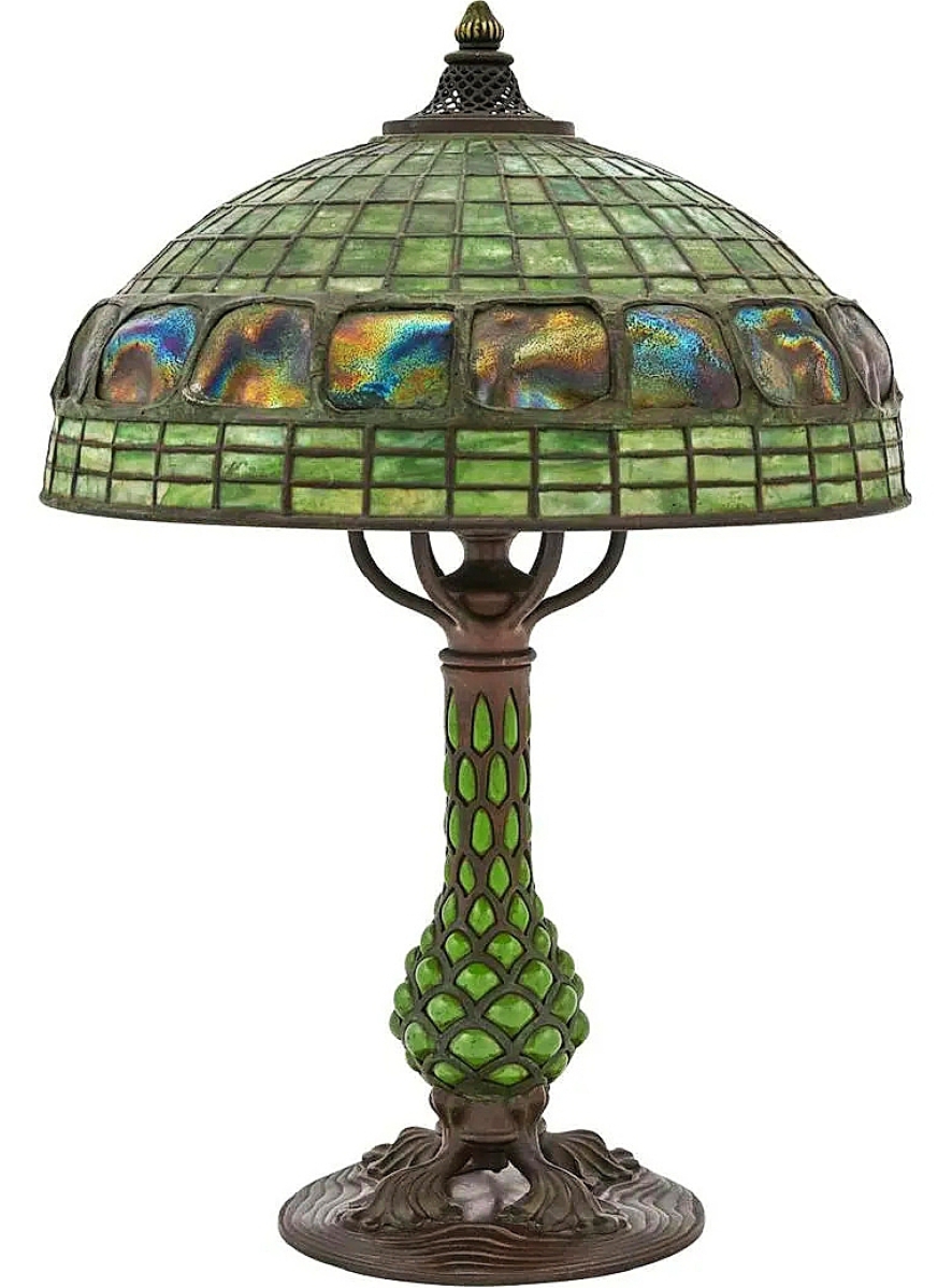 The sale was led at $81,900 by a fine Tiffany Studios table lamp with bronze pineapple base and a turtleback shade. Along with the Tiffany Studios lantern in this review, it was gifted to the consignor by collector Lee B. Anderson.