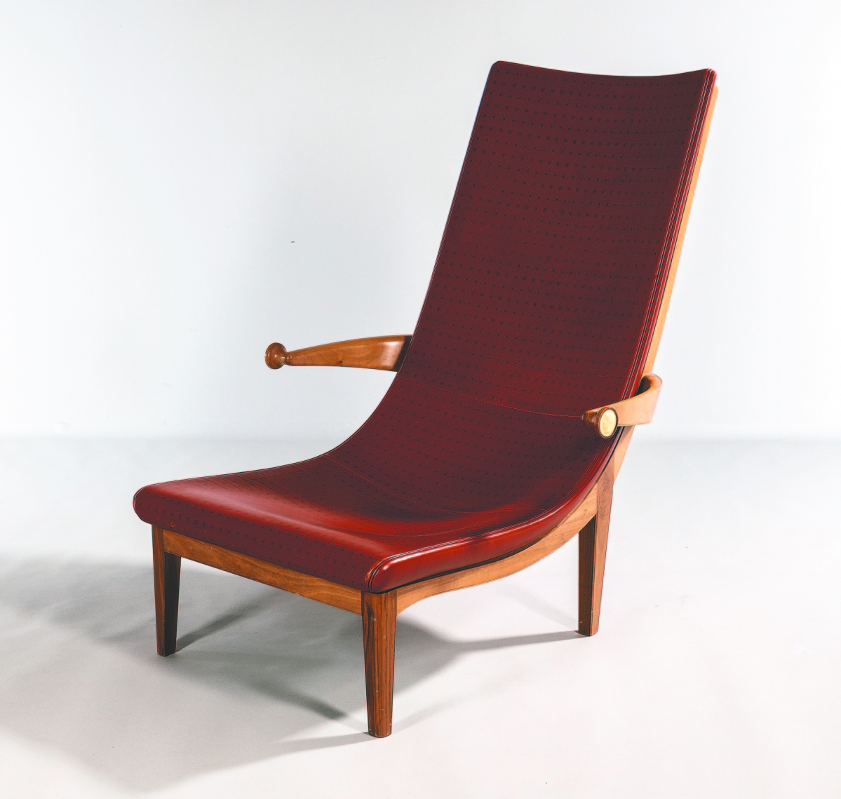The “Senna” lounge chair was designed by Erik Gunnar Asplund in 1925 for the Swedish Pavilion at the International Exhibition of Decorative Arts in Paris. It was rereleased by Cassina in 1983. The sides of armrests are adorned with a classical relief bust like that of a Greek or Roman coin. It sold for $13,750.