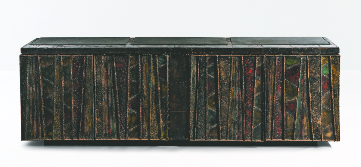 The consignors of this Paul Evans Deep Relief steel sideboard bought it new in 1969 from the Rapids Furniture Company in Boston. It sold for $50,000.