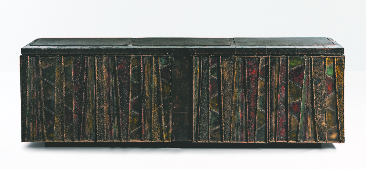 The consignors of this Paul Evans Deep Relief steel sideboard bought it new in 1969 from the Rapids Furniture Company in Boston. It sold for $50,000.
