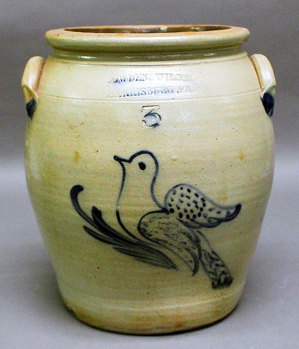 The highest price realized for one of nearly a dozen lots of Cowden & Wilcox cobalt-decorated stoneware was $8,120 for this 3-gallon semi-ovoid jar with winged dove decoration. It sold to a Southern Pennsylvania buyer. According to the catalog, the piece was published in Matthew R. Miller’s 2001 book, Decorated Stoneware of Cowden.