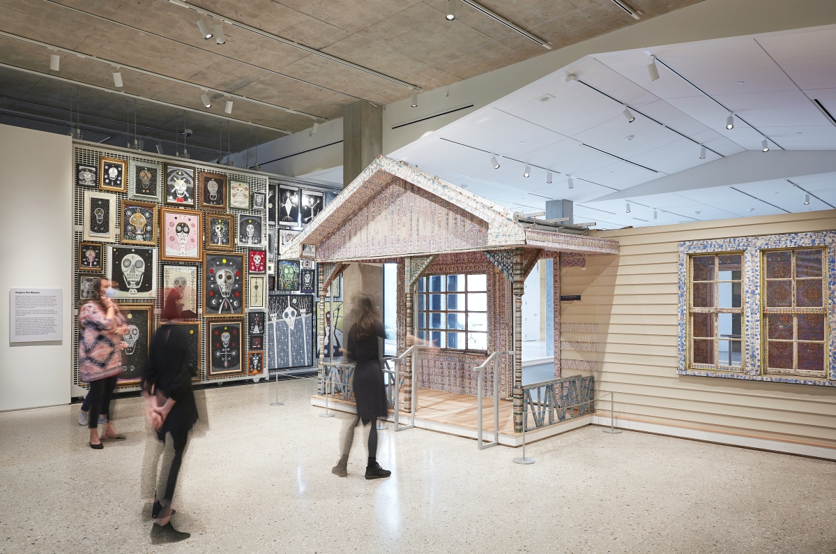 The glittery Beautiful Holy Jewel Home by Loy Bowlin is flanked by an installation of paintings by Gregory Van Maanen. Photo Rich Maciejewski, courtesy of John Michael Kohler Arts Center.