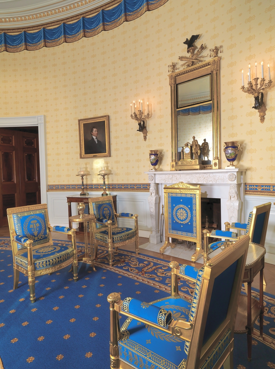 Reguilded and reupholstered with the support of the White House Historical Association, pieces of the historic Bellangé furniture suite surround the fireplace in the Blue Room of the White House, 2020. The fire screen was returned to the Blue Room in January 2020 after 161 years away from its original place in the White House. Photo credit: Bruce White photo for the White House Historical Association.