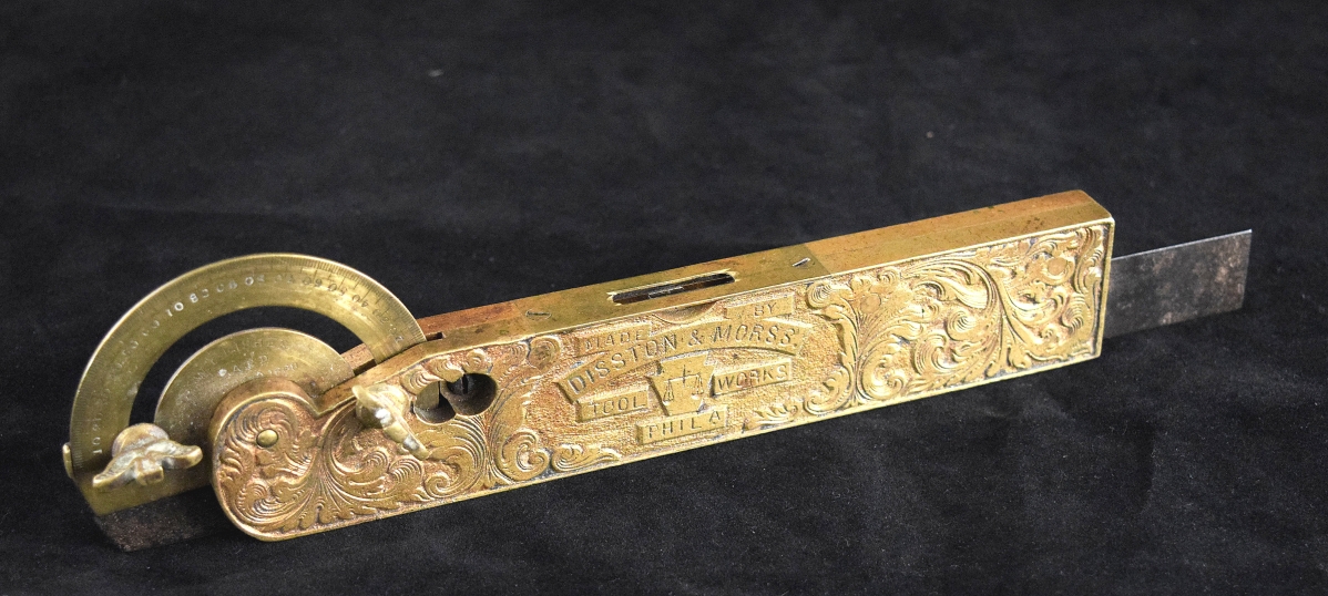 The firm of Disston & Morss produced this elaborately decorated and gold-plated measuring instrument as a “show piece” for their display at the 1876 United States Centennial Exhibition in Philadelphia. Combination square, level and protractor by [Henry] Disston & [Joab] Morss, Philadelphia, 1876. Brass, steel, gold plating.