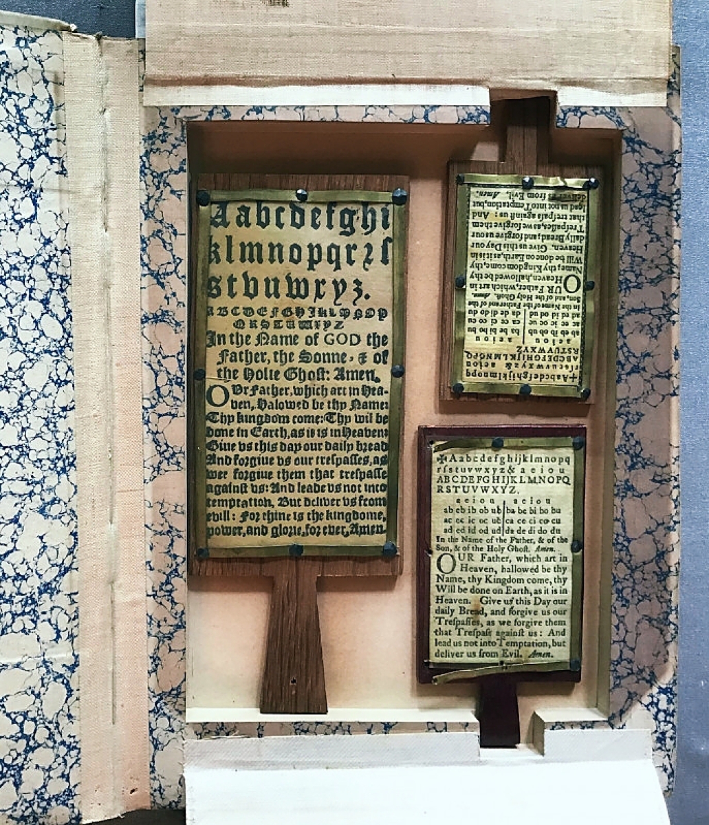 A Seventeenth Century English hornbook made of horn and paper was priced at $2,200 and still available. Kathleen Staples Fine Antique Textiles and Books, Greenville, S.C.