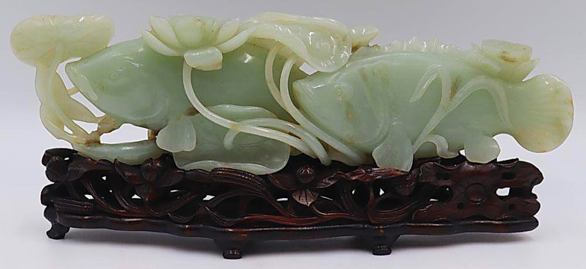 One of two lots to hit the top price of $50,000 was this carved jade group of two carp swimming among sea foliage. From the New Rochelle estate, it measured 12 inches long and weighed 2½ pounds ($ ,000).