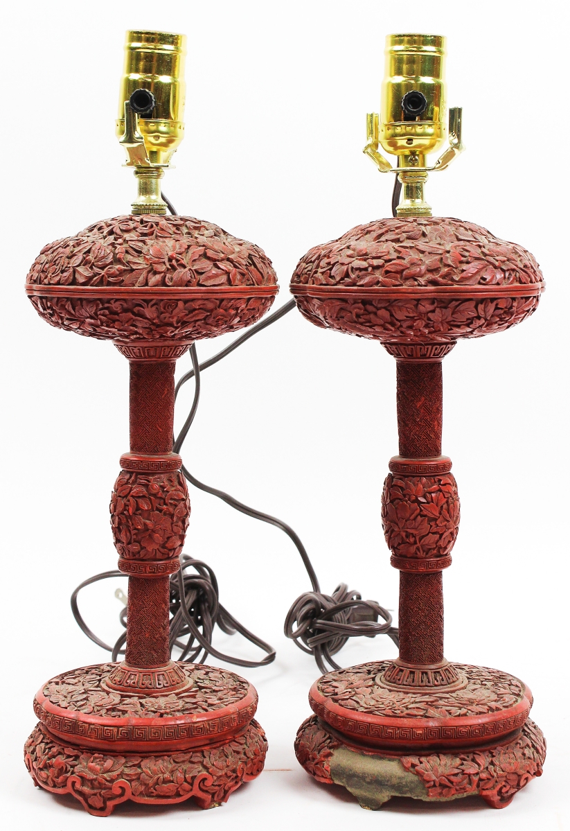 Going out at $9,225 was this pair of Oriental cinnabar lacquered table lamps, one with losses at base, overall heights of 15 inches.