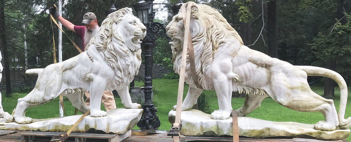 This pair of muscular marble lions from Searles Castle would roar to $6,372.