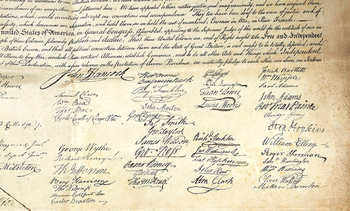 Signatures at the bottom of the document. Carroll’s signature is four signatures below that of John Hancock.