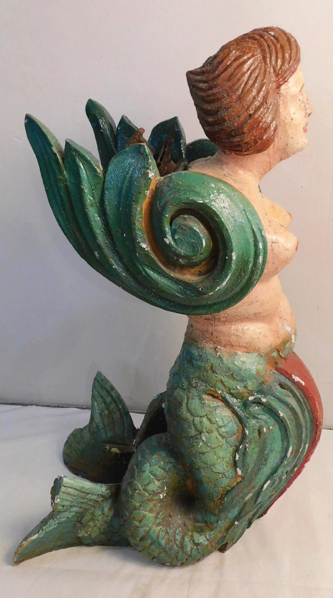 Among the figureheads crashed this mermaid with flourishing wings and coiled tail. She was 45 inches tall and dated to the Nineteenth Century. With repaint, she went out at $7,800.