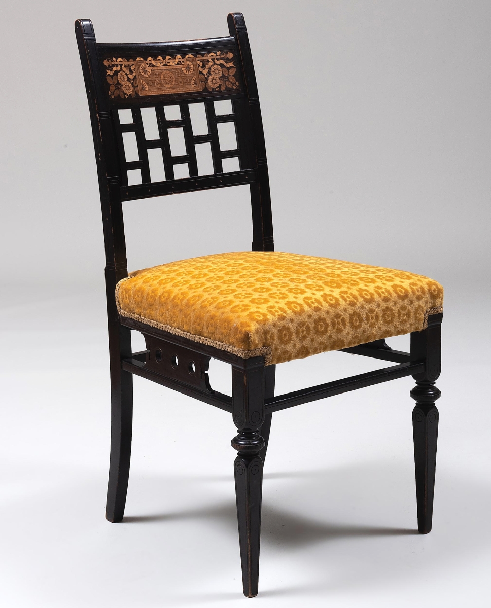 An online bidder from the trade paid $12,300 for this Aesthetic Movement ebonized, parcel-gilt and various woods marquetry inlaid side chair by Herter Brothers that was numbered “5710” under the seat ($7/10,000).