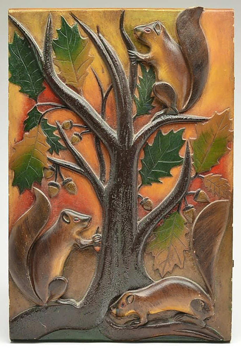 Oscar Peterson is best known for carvings of fish decoys, but he also carved other objects. One of his most unusual works was a wall plaque with three squirrels in a tree gathering nuts, which sold for $69,000.