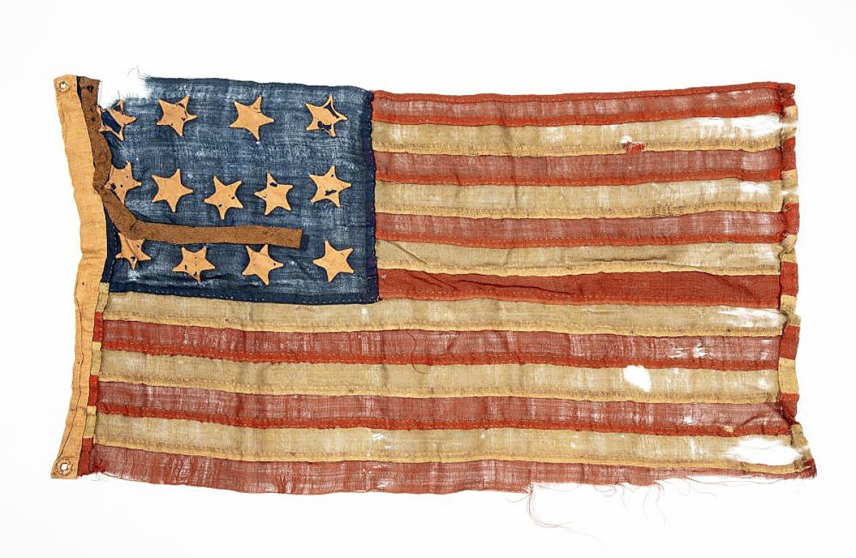 Going to a LiveAuctioneers bidder was an American 13-star colonial flag, a homemade folk art that was probably used for a play, pageant, parade or school activity. Measuring 28½ inches, it was bid to $11,400.