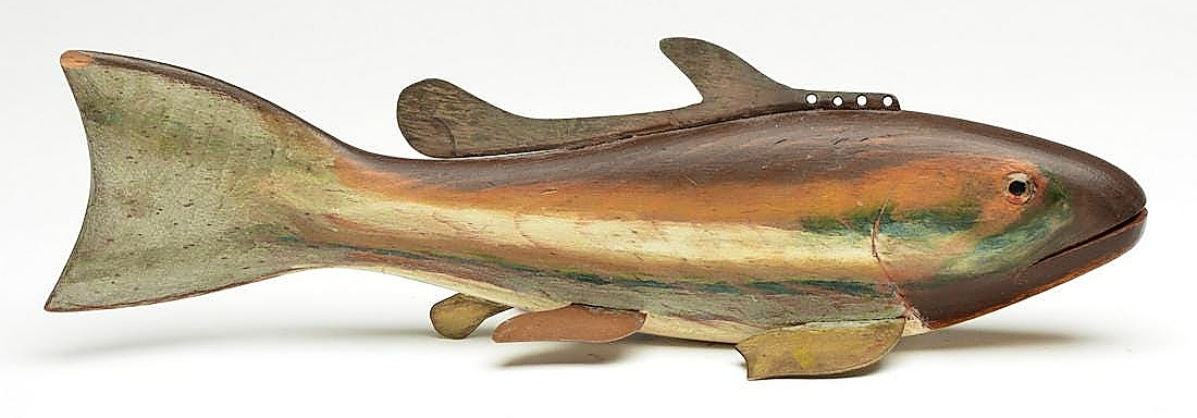 At $108,000, this fish decoy was one of the surprises of the auction. Hans Jenner carved and painted this walnut fish, a so-called “ghost fish.” Called by some “a fish on fish,” the painting on each side of the body is done in such a way as it appears a second fish is swimming alongside the larger one.
