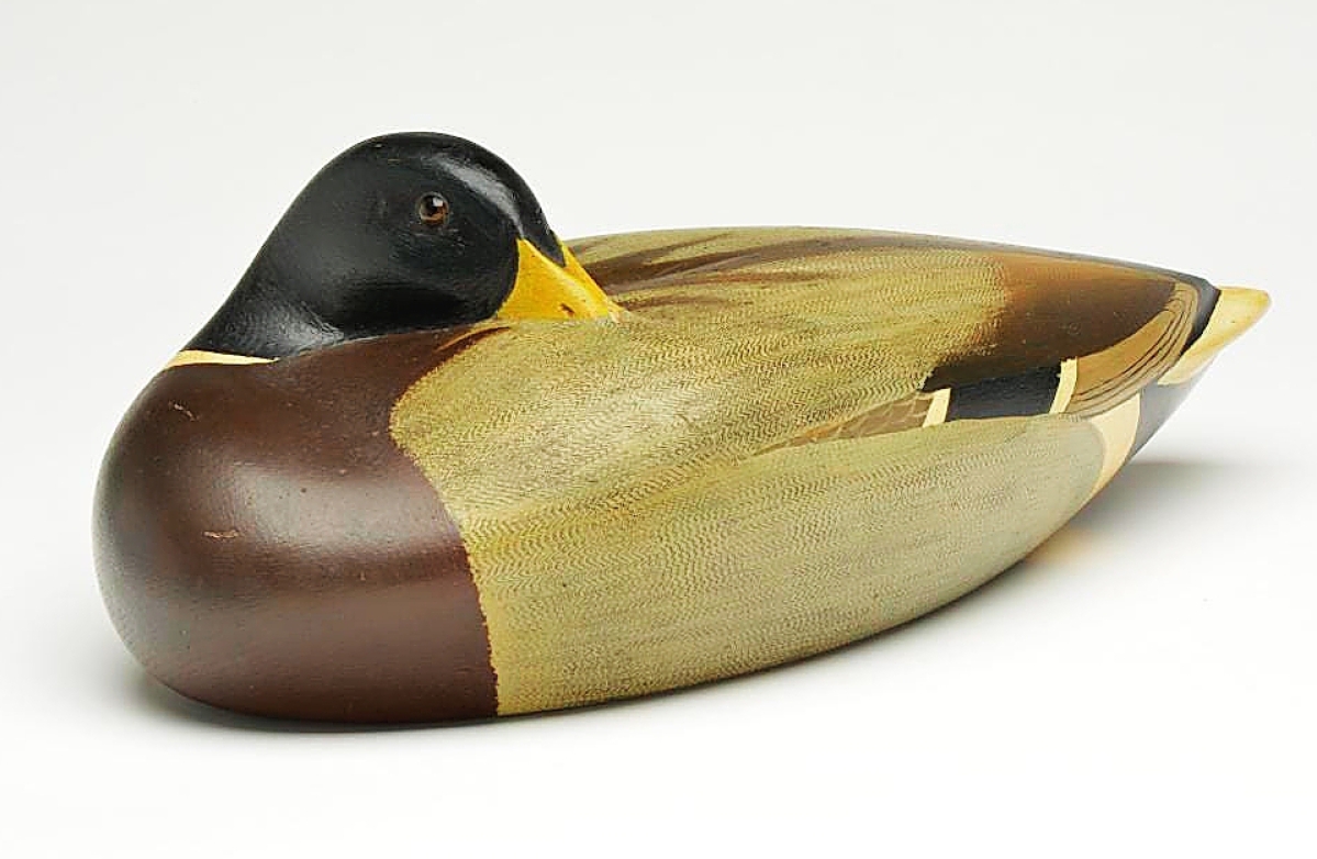 The sale’s highest price, $144,000, was earned by Shang Wheeler’s rare mallard drake, circa 1940, in an at-rest pose. Wheeler mostly carved decoys for his own personal use and this is believed to be the only sleeping mallard he made.