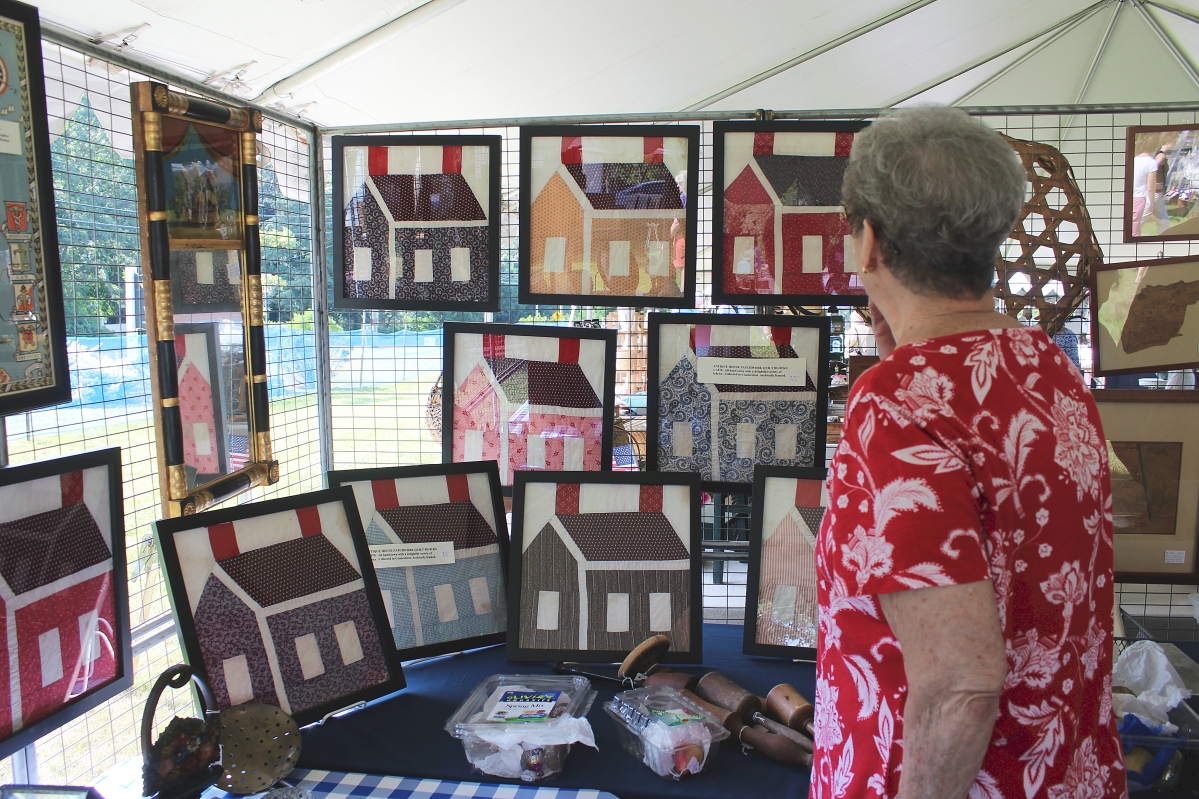 Patty Kerr lives in Pittsburgh, Penn., and visits the Cape with her husband, Jim, every year. She is a quilter and was admiring framed schoolhouse quilt panels that were being sold individually by David and Jane Thompson, David Thompson Antiques & Art, South Dennis, Mass.