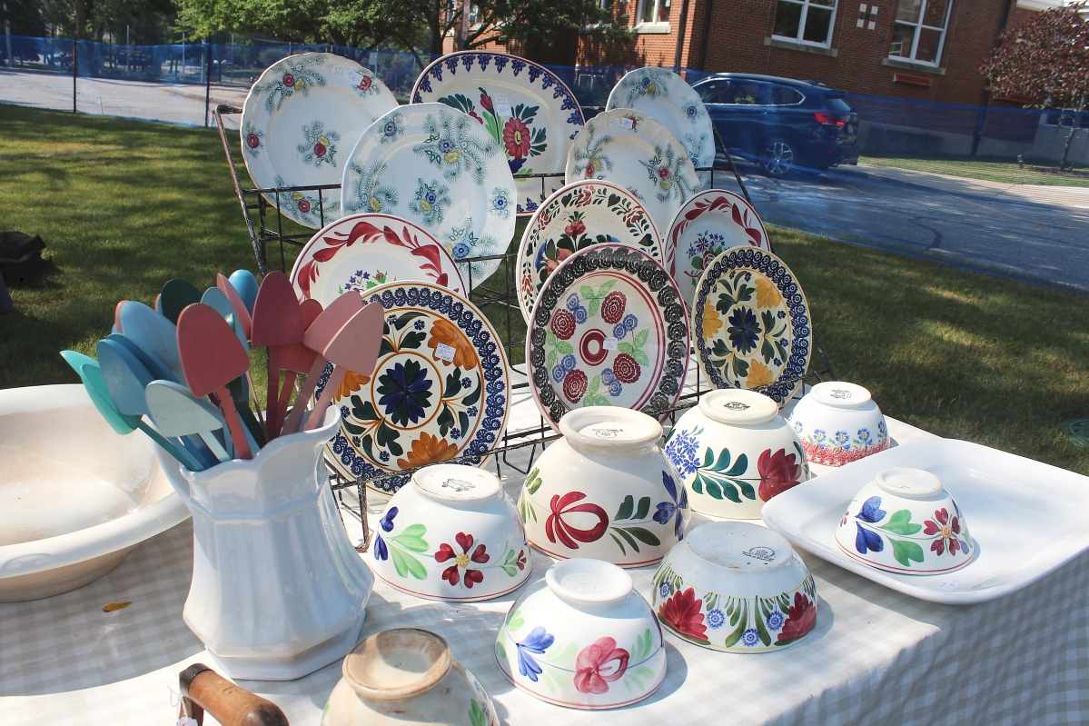 Feathered Star Antiques, East Dennis, Mass., had this vibrant display of Staffordshire plates and bowls and vintage ladies’ shoe trees colorfully arranged in a “bouquet” in a white pitcher.