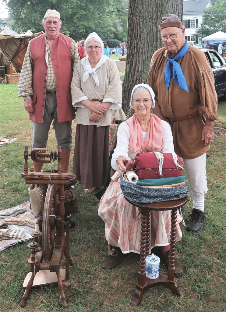 Lynne White, seated, and her husband, Buster, right, with Neil and May Muckenhoupt. The four friends are historic reenactors who travel to events around New England and upstate New York.