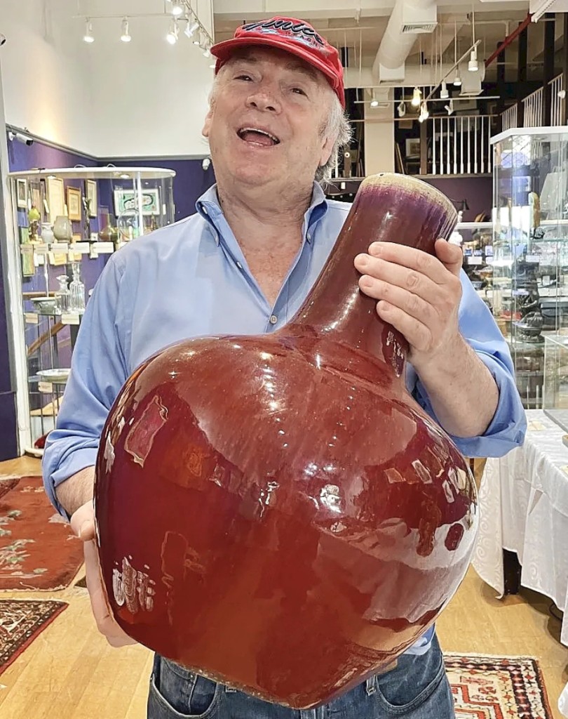 David Killen holds his top lot with both hands — a monumental Sang de Boeuf vase dating to the Eighteenth or Nineteenth Century. Bidders pursued it to the sale’s top lot at $28,800.
