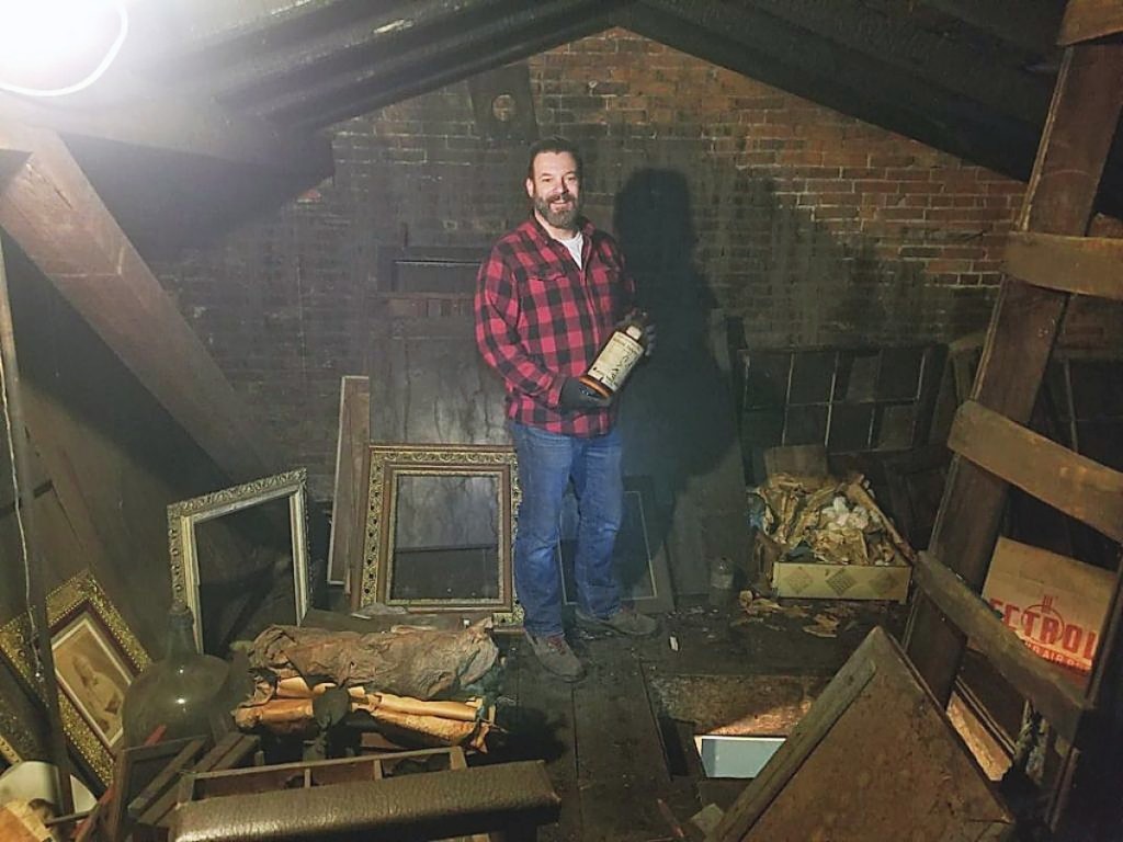 David Whitcomb stands in the attic after he discovered JE Hale’s skylight photography studio.   —Photo David Whitcomb