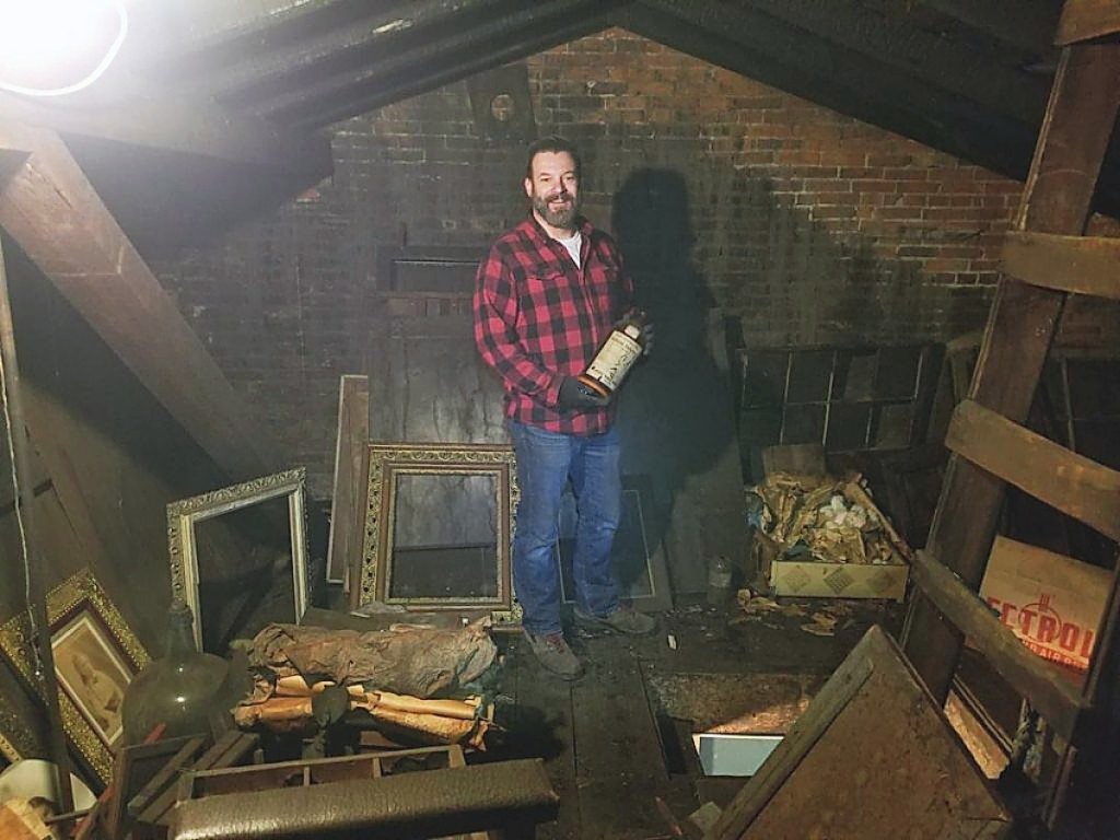David Whitcomb stands in the attic after he discovered JE Hale’s skylight photography studio. —Photo David Whitcomb