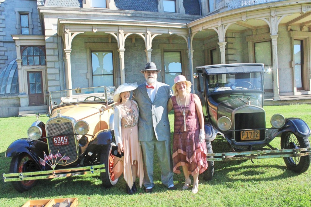 The Lockwood-Mathews Mansion made a perfect backdrop for an antique classic car show mounted by the Connecticut Seaport Car Club. Standing next to a 1926 Ford Model T and 1931 Ford Model A are car club members, from left, Karen Milosky, Mark Milosky and Lissa Seeburger.