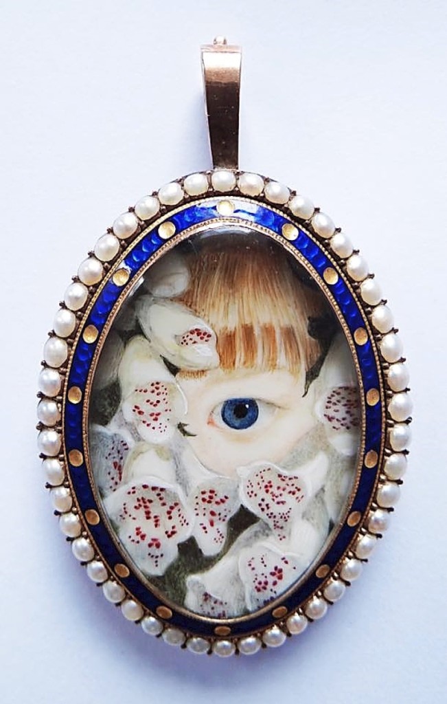 Eye of Mary Sarah Fox, enveloped in foxgloves,   set in a gold frame with seed pearl and   guilloche border, circa 1835.