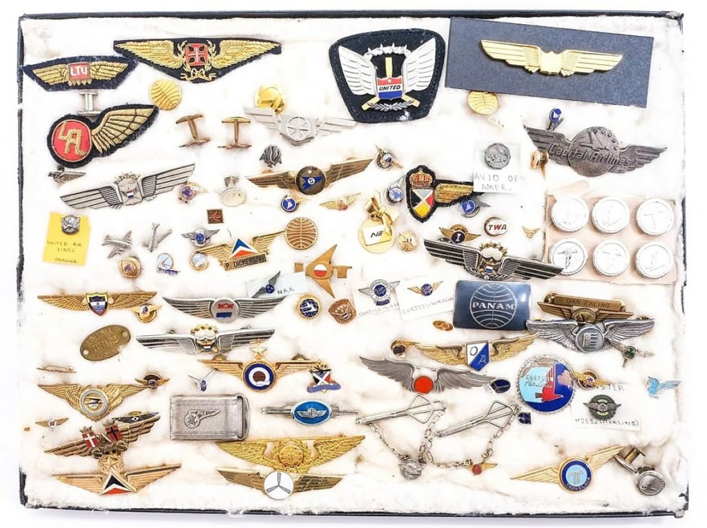 Online competition propelled this group lot of more than 70 airline pins and collectibles to $1,968. Ryan Brechlin said the original — rather than souvenir or junior — pilots and stewardess wings helped drive interest in the lot ($ ,000).