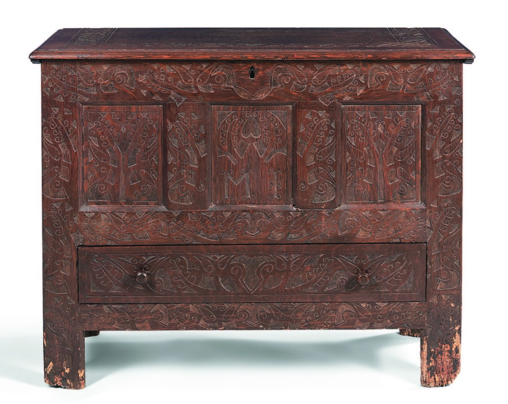 It was expected to be the highest priced item in the collection, and it was. The Connecticut River Valley Hadley chest with a replaced top sold for $31,250. Dating to the early Eighteenth Century, the chest had overall flat tulip carving with the initials “MI” within the central panel.