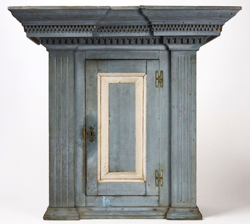 It was described as a “museum-quality” American hanging cupboard, circa 1760. Standing 35 inches high and 37½ inches wide and finished in original blue and oyster white paint, it found a buyer at $18,750.
