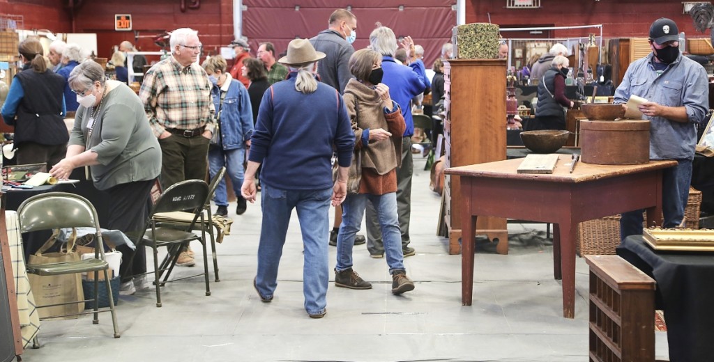 Buyers wandered through the aisles shortly after the show opened. —Black River Antique Show