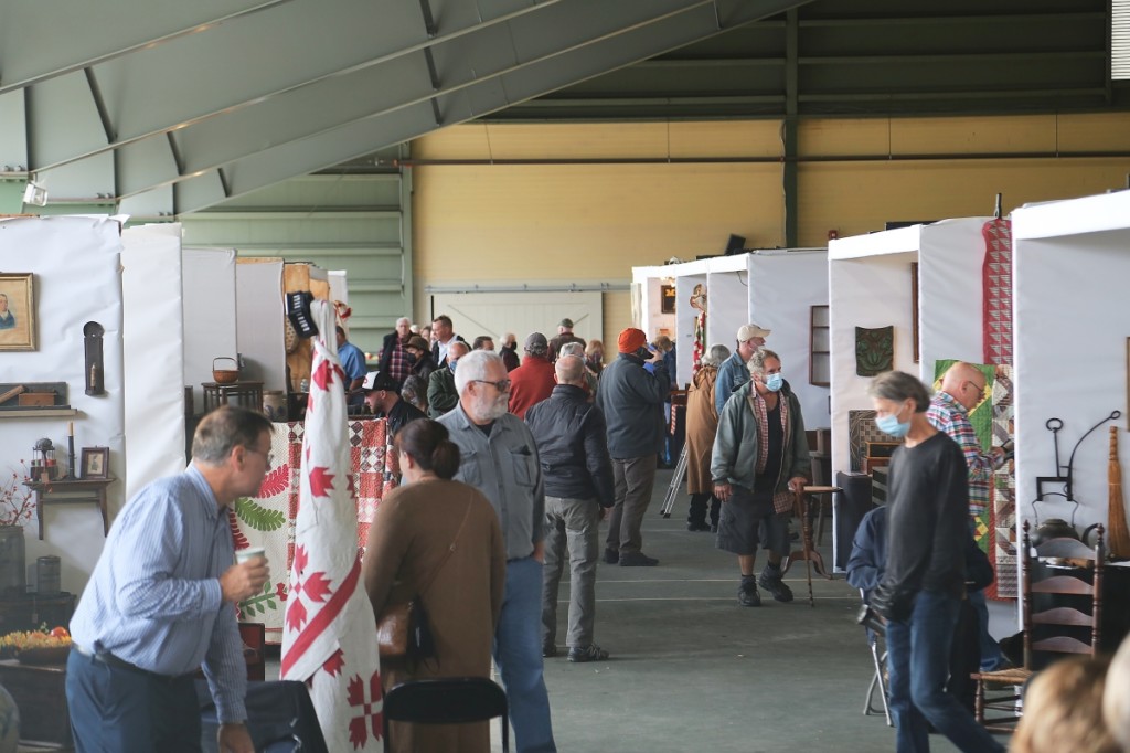 A large pavilion kept shelter over the rows of dealers at Antiques at the Icehouse.