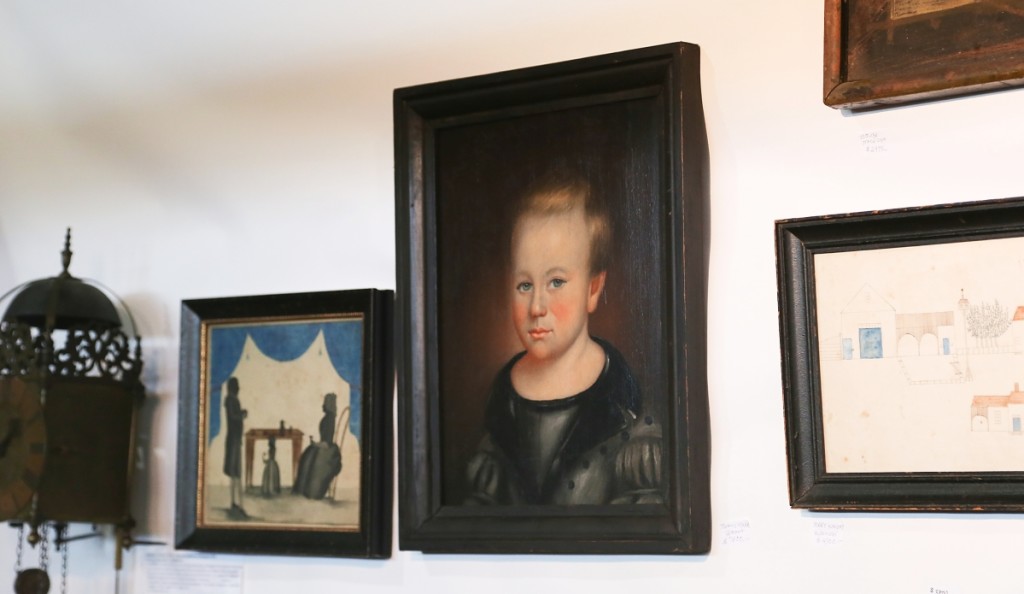 Itinerant Vermont folk artist Thomas Ware painted this portrait of a young boy. It was with Antiques Associates at West Townsend, West Townsend, Mass. —Antiques at the Icehouse