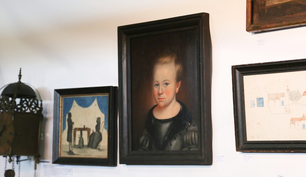 Itinerant Vermont folk artist Thomas Ware painted this portrait of a young boy. It was with Antiques Associates at West Townsend, West Townsend, Mass.   —Antiques at the Icehouse