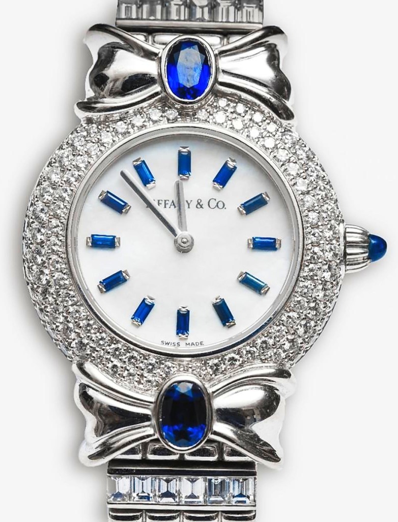 A Tiffany & Co 18K gold and sapphire watch, custom made, finished at $25,000. Boasting baguettes and round brilliant cut diamonds and sapphires, the white gold bracelet watch with mother-of-pearl dial and sapphire hour markers was said to retail $140,000.