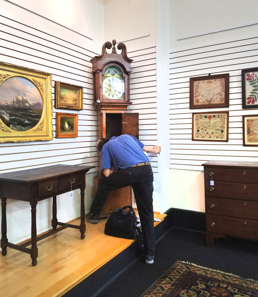 Philip inspecting a clock at Pook & Pook in June 2020. Courtesy Lisa Minardi.