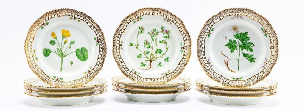 This 12-piece set of Royal Copenhagen Flora Danica 10-inch dinner plates featuring botanical motifs with gilt and reticulated rims went out at $21,080.