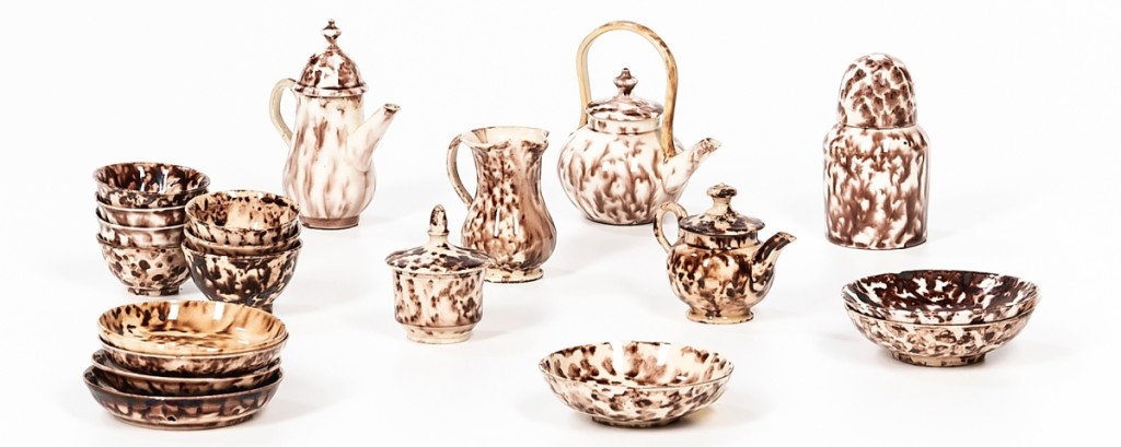 The tallest piece of this miniature Staffordshire tortoiseshell-glaze tea set, dating to the third quarter Eighteenth Century, was only 3 inches tall. The set included three teapots, a tea caddy, a cream jug, a covered sugar bowl, seven tea bowls and saucers, and it realized $1,250.