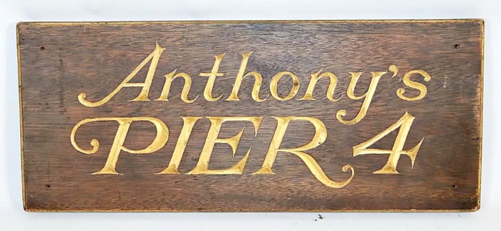 Selling for $720, this 22-inch carved and gilded sign greeted visitors to Anthony’s Pier 4 restaurant in Boston. It was mounted on the podium, near the entrance.