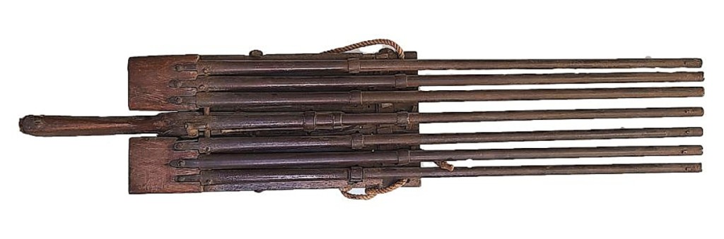 Guns such as this, used by market gunners until they were outlawed, were capable of killing dozens, if not more, birds at one time, and few have survived. This rare, seven-barrel percussion battery gun has barrels that measure ¾-inch in diameter. The barrels are 42 inches long and the gun earned $21,000. Some, probably this one included, were cumbersome, homemade but effective weapons, and the sale catalog includes an extensive discussion of these guns. There were numerous accidents recorded by men using these mass killing weapons. Some market gunners mounted their weapons directly onto their boats. They were almost as dangerous to those using them as they were to the birds. Set-ups like this were usually used to sneak up on a flock resting on the water.