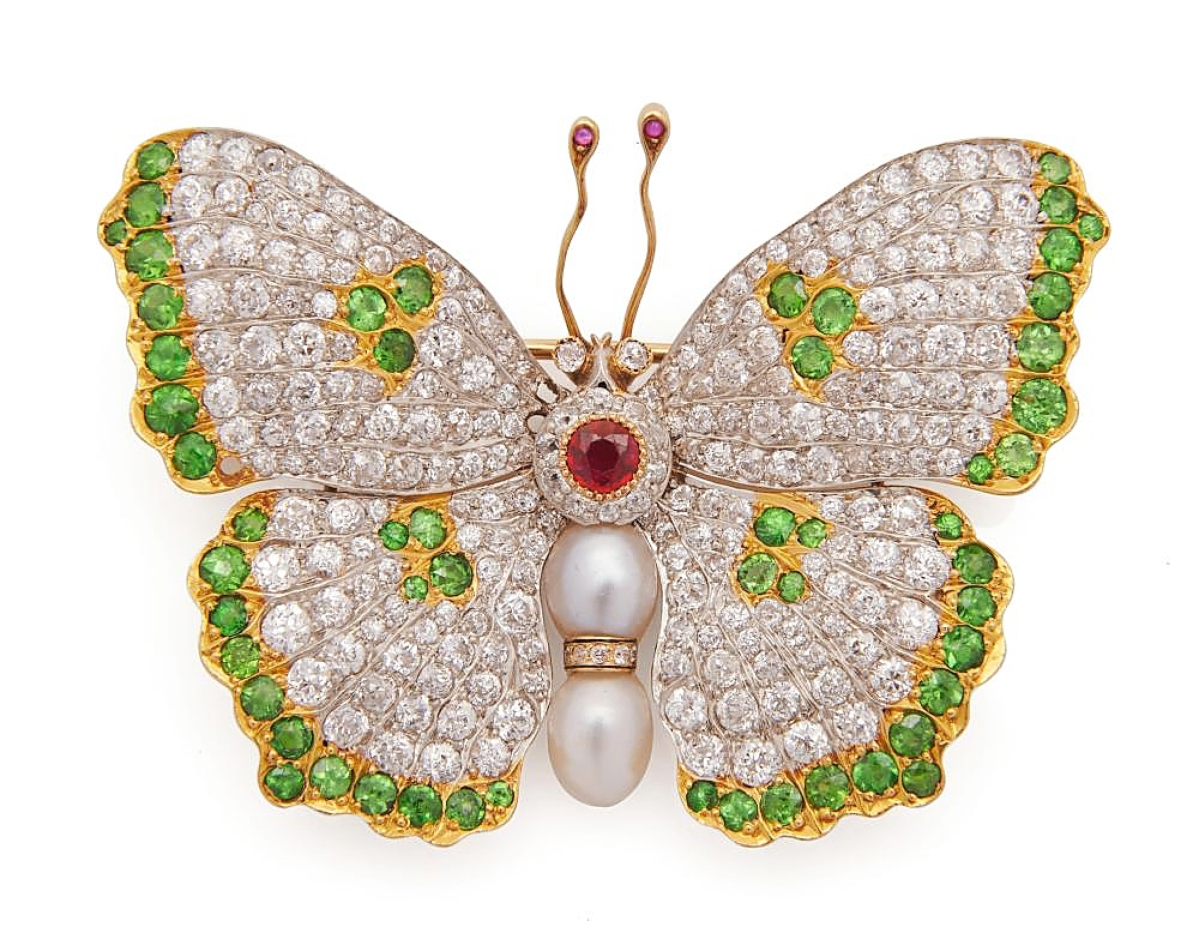 It was a good day for brooches. This one had a lot going for it — 18K gold and platinum, with diamond, garnet, pearls and rubies in the form of a butterfly, and it reached $31,250. It dated to the Nineteenth Century.