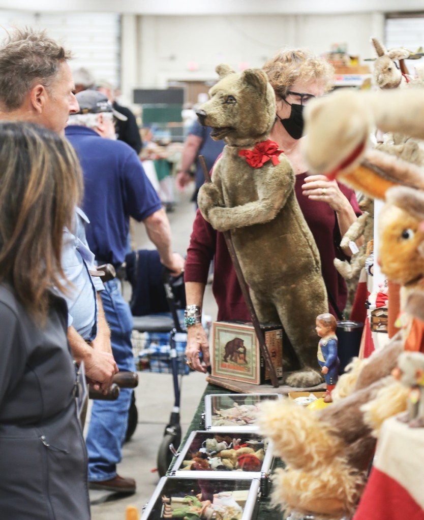 Buyers were drawn to a store display nodder bear with mohair fur. He was with Nancy McGlamery and Ed Pelton.