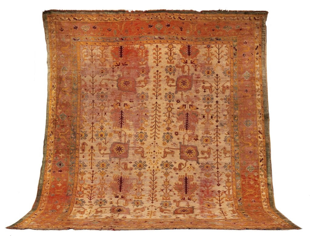 This late Nineteenth Century Oushak with a cream field filled with rows of geometric designs with multiple multicolor geometric borders outperformed its $1/1,500 estimate to command $4,800.