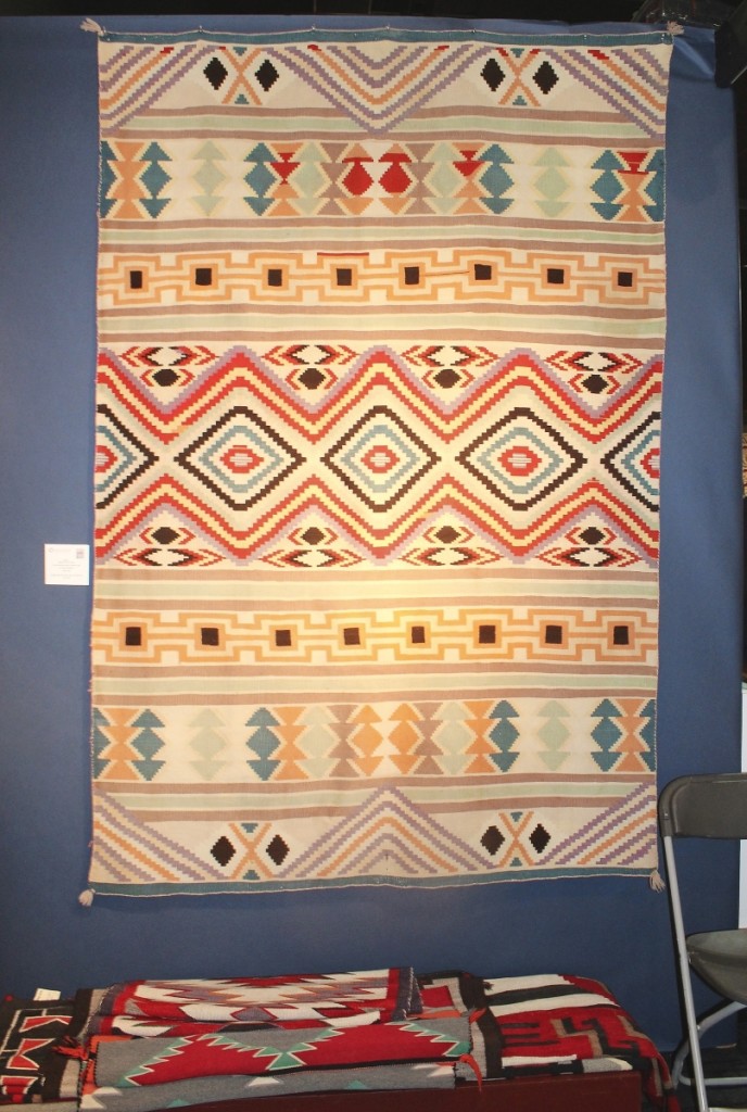 This Navajo serape with three-ply wools dated to 1865-70 and was with Marcy Burns American Indian Arts, LLC, New York City.
