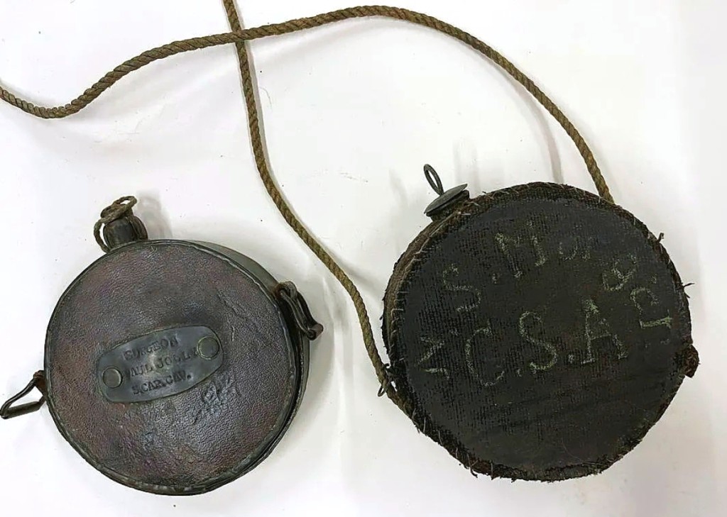The canteen on the left is marked for surgeon Paul Jolly of the South Carolina cavalry. The other is marked for an NS Morgan — both Confederate soldiers. The group sold for $3,540.