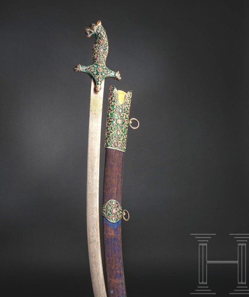 This Perso-Indian shamshir with blade dedicated to Shah Nadir Afshar and made by Asadullah Isfahani was heavily encrusted with jewels and gilt inscriptions and realized $225,010, one of the top prices realized throughout all of the sessions.