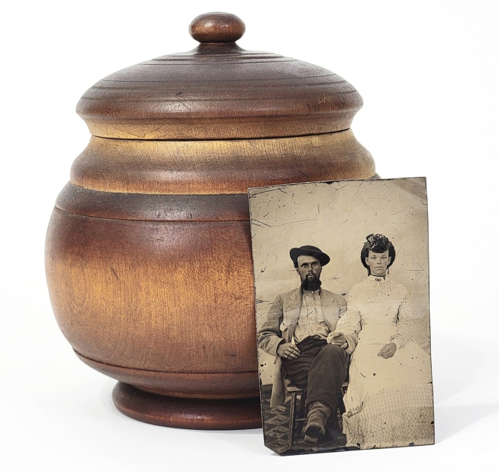 An object and its owners.  This turned maple sugar bowl is illustrated with a photograph of its original owners, members of the Pease family, Concord, Ohio, late 19th/early 20th century.  Private collection.
