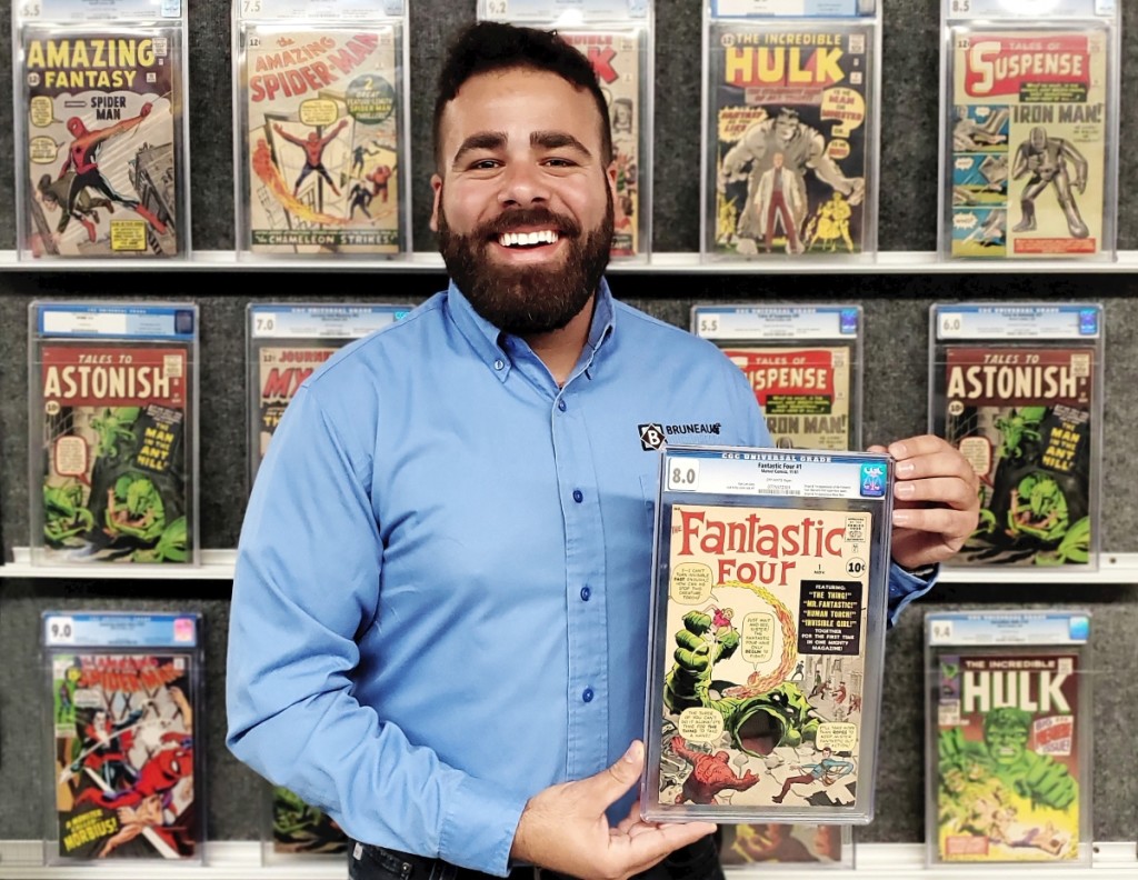 A repeat buyer with deep pockets who is a comics investor as well as a connoisseur paid $150,000 for the sale’s top lot, Marvel Comics Fantastic Four #1, which Travis Landry is shown holding here. It set a new record for that issue in CGC 8.0 grade ($50/80,000).