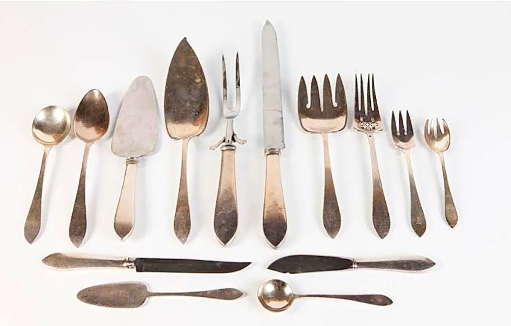 A 193-piece Tiffany & Co. Faneuil pattern sterling silver flatware, partially shown here, went out at $7,015.
