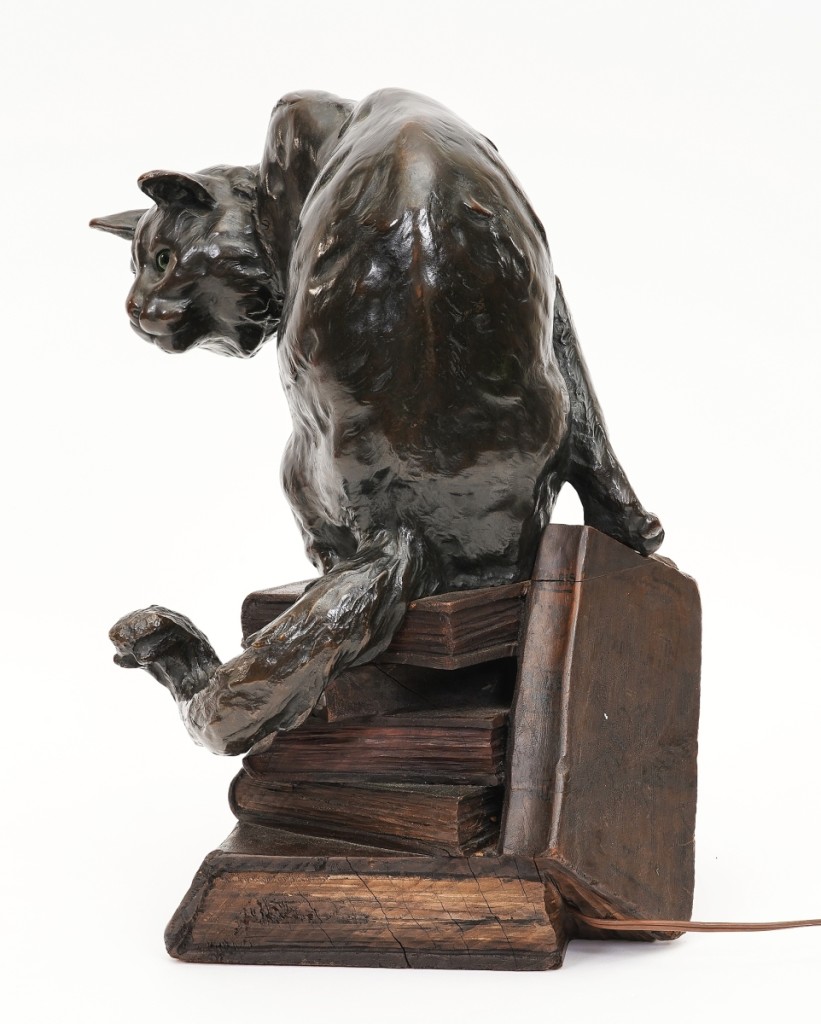 A Jean Carrit (b 1898) bronze cat led the 434-lot sale at $11,250. The unusual bronze and wood sculpture lamp of a bronze cat perched atop a wooden stack of books with a small mouse peering out from the bottom of the stack was signed Jean Carrit and dated “94.” It was won by a local Pennsylvania collector of bronzes.